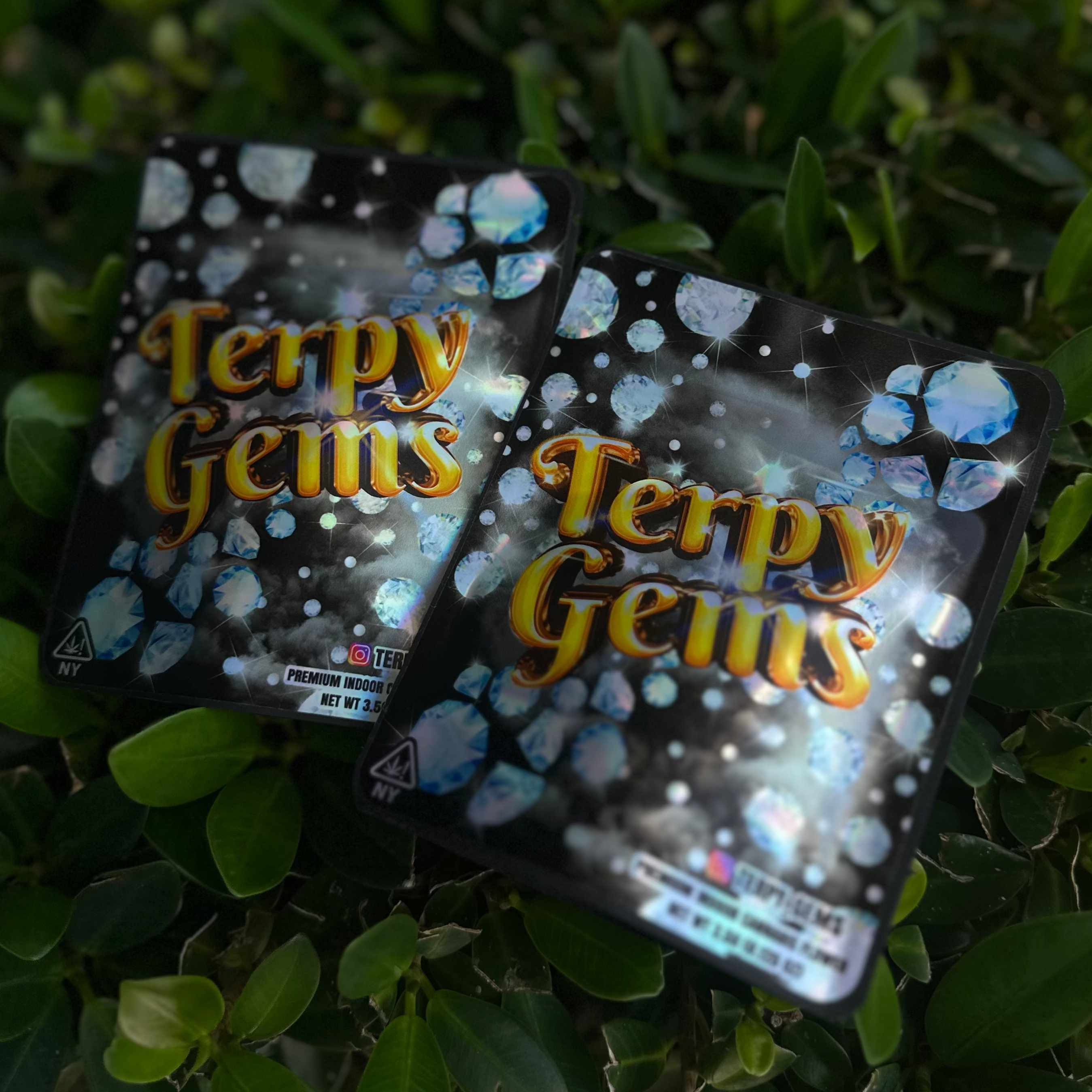 Two packages of Terpy Gems on a green leafy background